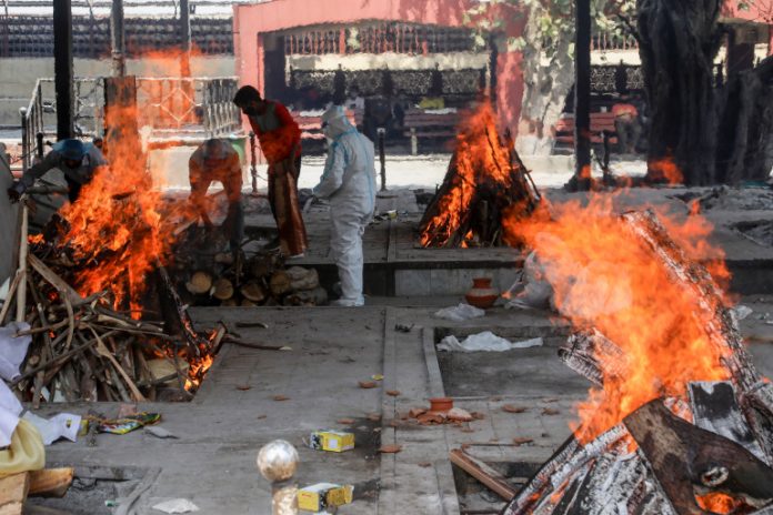 (EDITORS NOTE: Image depicts death)Relatives of COVID
