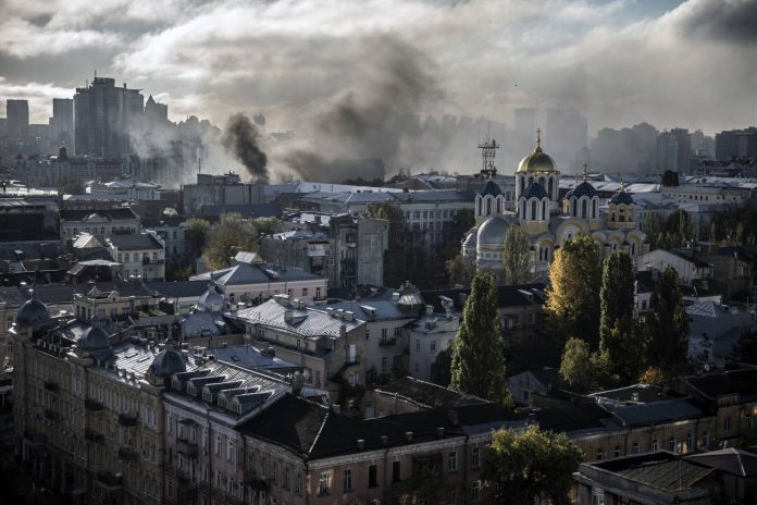 Smoke rises after a Russian missile attack on Kyiv, Ukraine, on Monday, Oct. 10, 2022. (Finbarr O'Reilly/The New York Times)